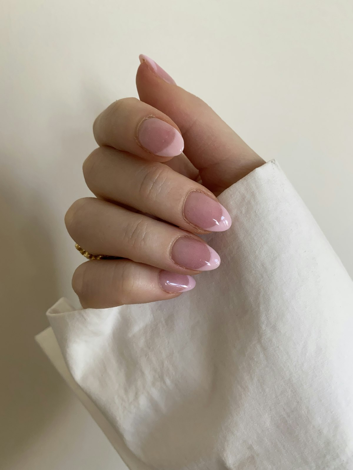 Clean close-up of pink press-on nails, featured image for nail trends article