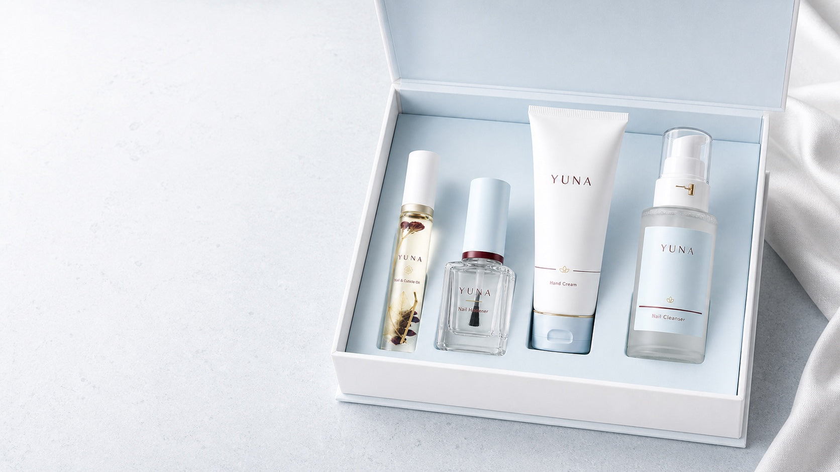 The complete Yuna Wellness nail care kit in its presentation box